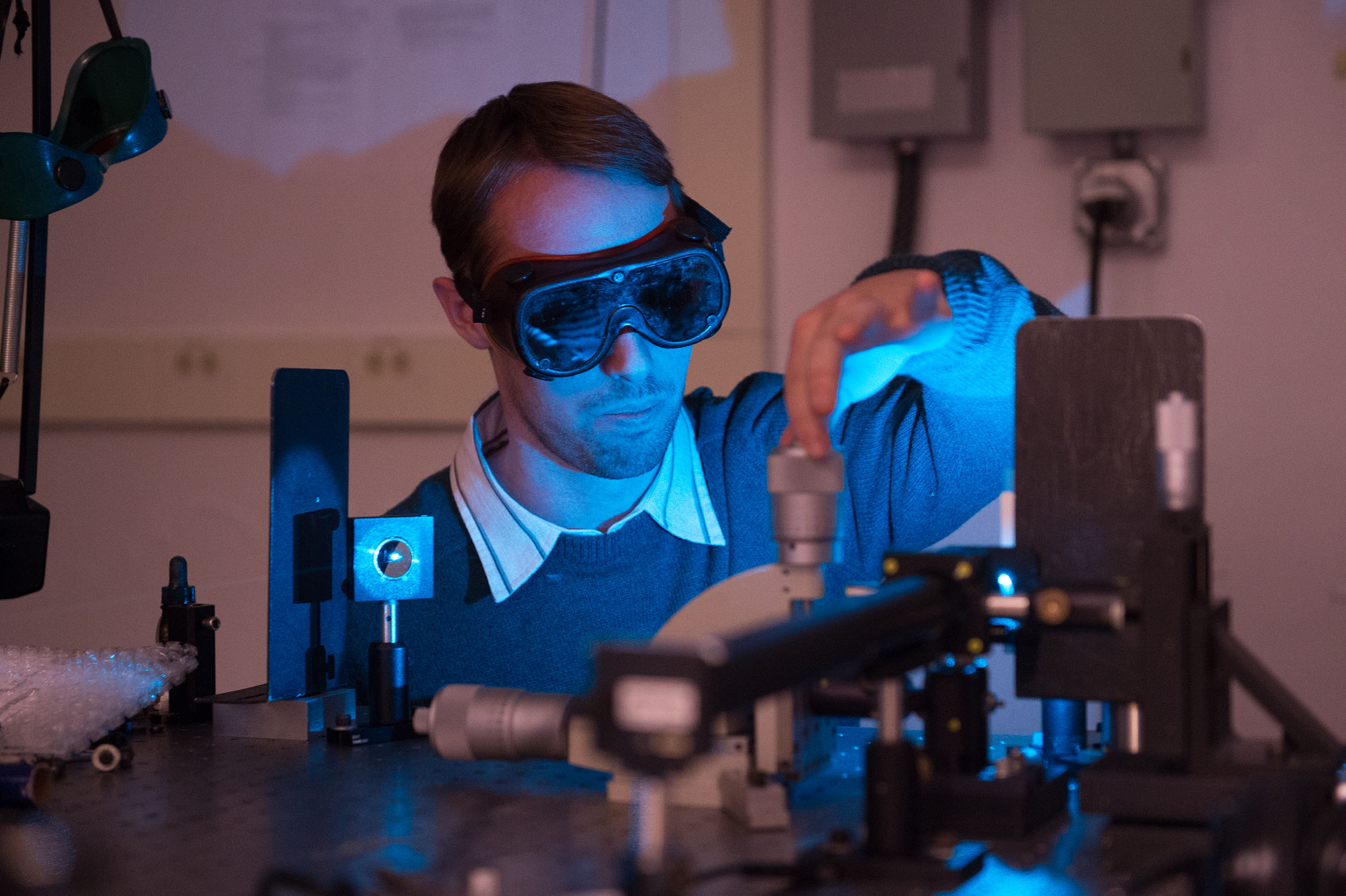 student in a laser lab