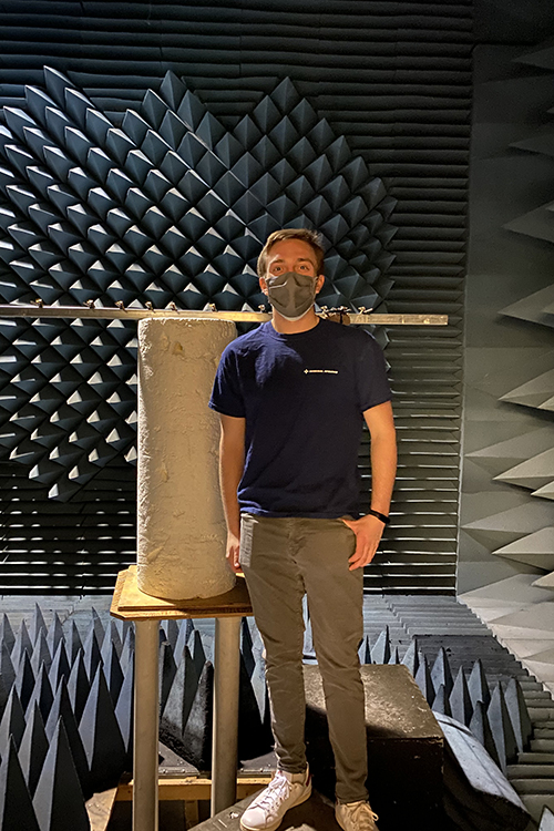 Joseph Rottner stands masked in the anechoic chamber of the RadLab